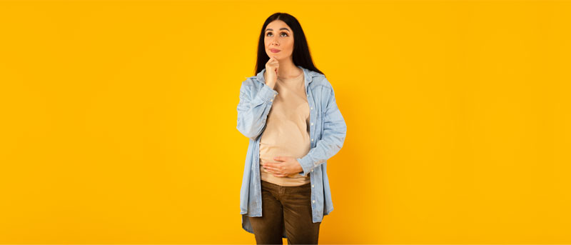 Confused and Thinking Young Pregnant Woman